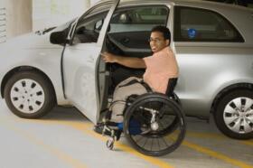 Wheelchair user getting into a car