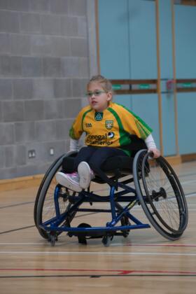 Girl using a wheelchair whilst playing sports