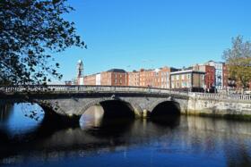 Bridge over water with buildings in the background