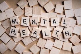 Mental health spelt out on wooden cubes