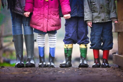 Four children in wellington boots